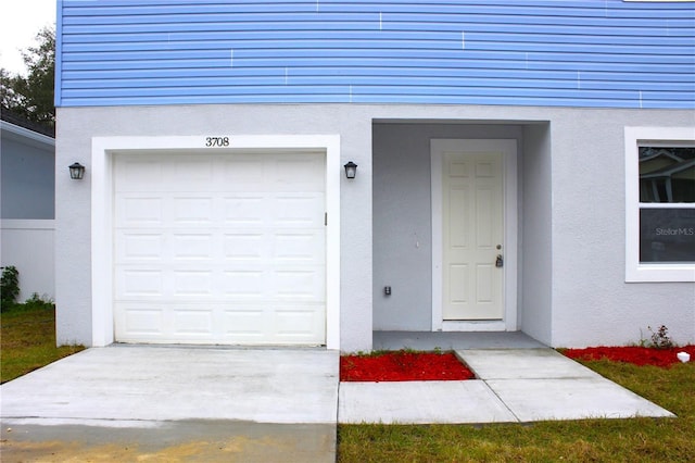 property entrance with a garage