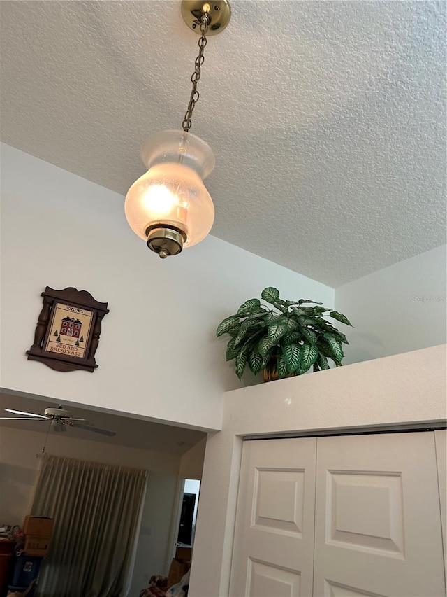 interior details featuring a textured ceiling