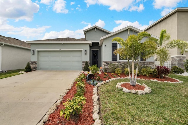 view of front facade featuring a front yard and a garage