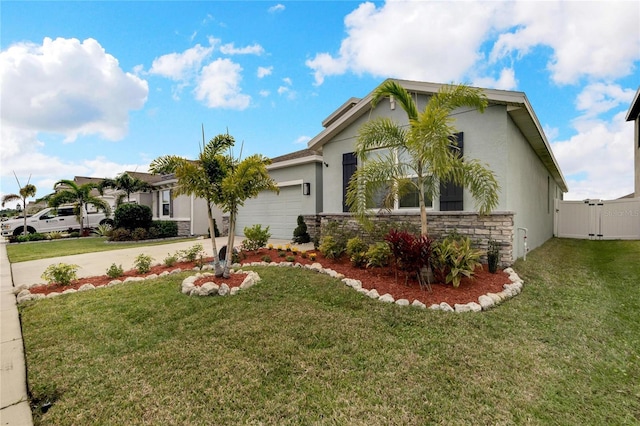 view of front of house featuring stucco siding, a front yard, a garage, stone siding, and driveway