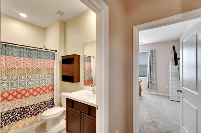 bathroom with visible vents, a shower with shower curtain, toilet, vanity, and baseboards