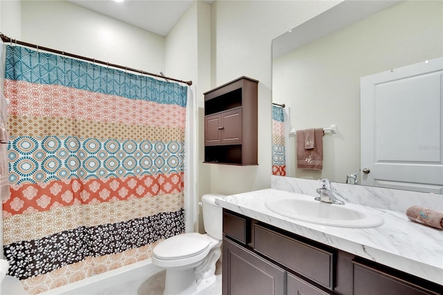 bathroom with a shower with curtain, vanity, and toilet