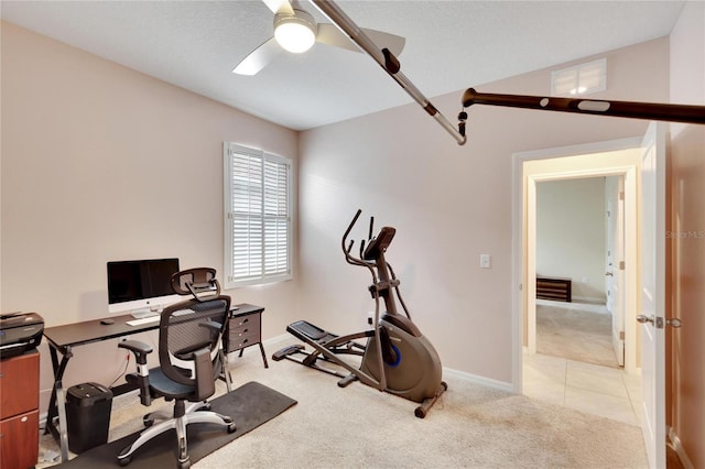 office with light carpet, visible vents, baseboards, lofted ceiling, and ceiling fan