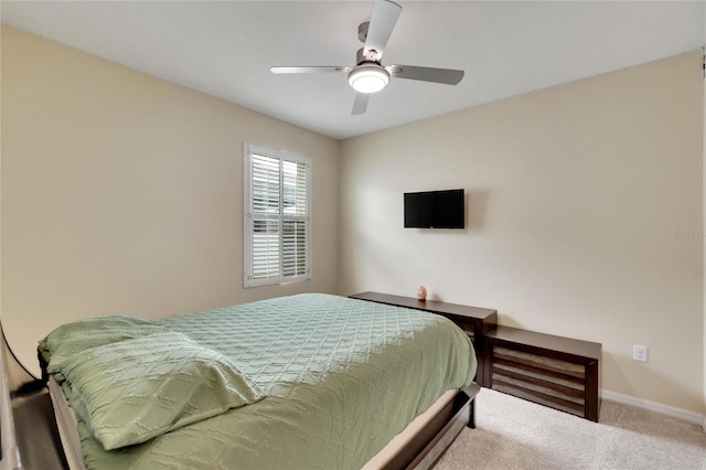 bedroom with carpet, ceiling fan, and baseboards