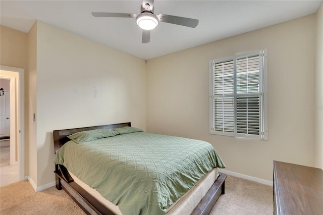 bedroom featuring a ceiling fan, carpet flooring, and baseboards