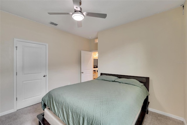 carpeted bedroom with a ceiling fan, visible vents, and baseboards