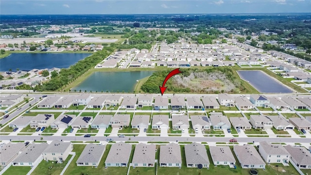 aerial view with a residential view and a water view