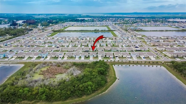 bird's eye view with a water view and a residential view