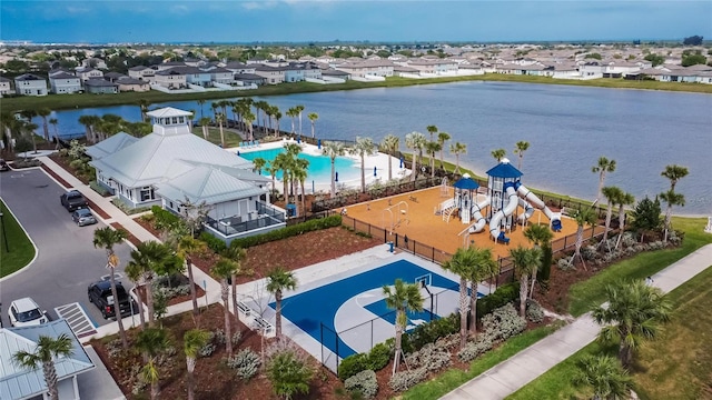 aerial view with a water view and a residential view