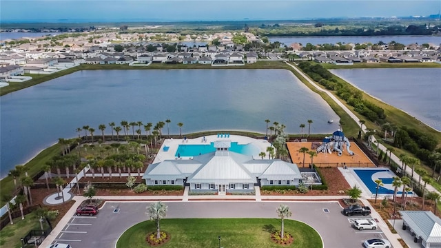 bird's eye view with a water view and a residential view