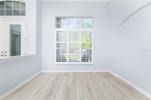 spare room featuring light hardwood / wood-style flooring