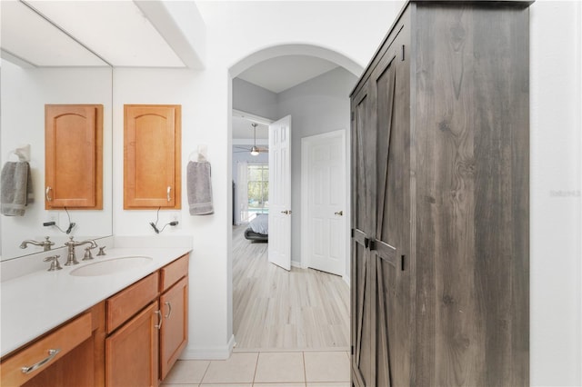 bathroom featuring vanity, ceiling fan, and hardwood / wood-style flooring