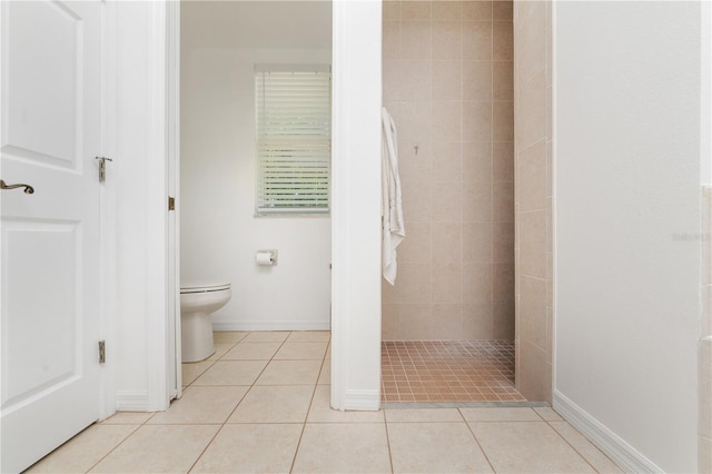 bathroom with toilet and tile flooring