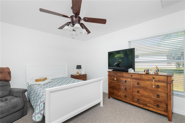 bedroom featuring ceiling fan and light colored carpet