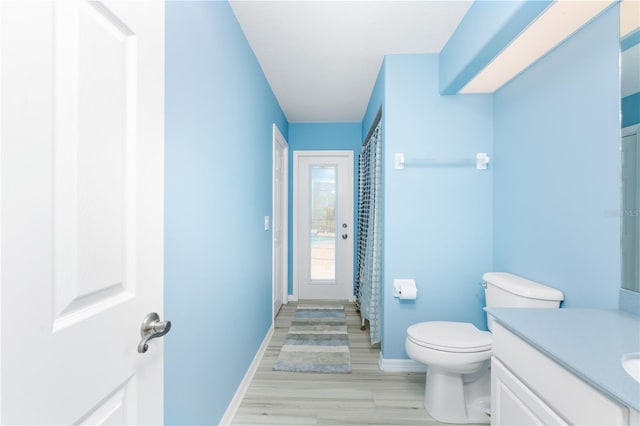 bathroom featuring toilet and vanity