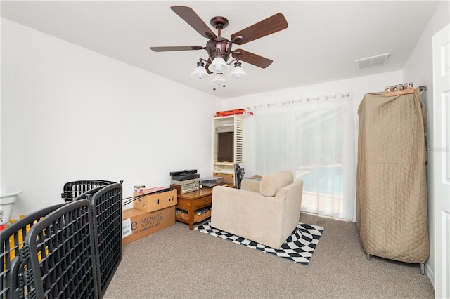 interior space with ceiling fan