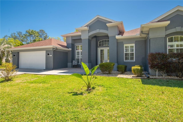 view of front facade featuring a front lawn and a garage