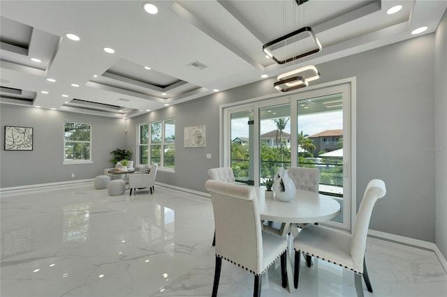 tiled dining area featuring a tray ceiling and coffered ceiling