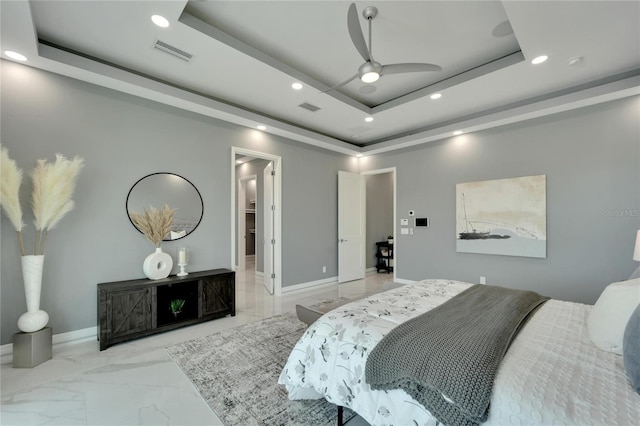 bedroom with ceiling fan, light tile flooring, and a raised ceiling