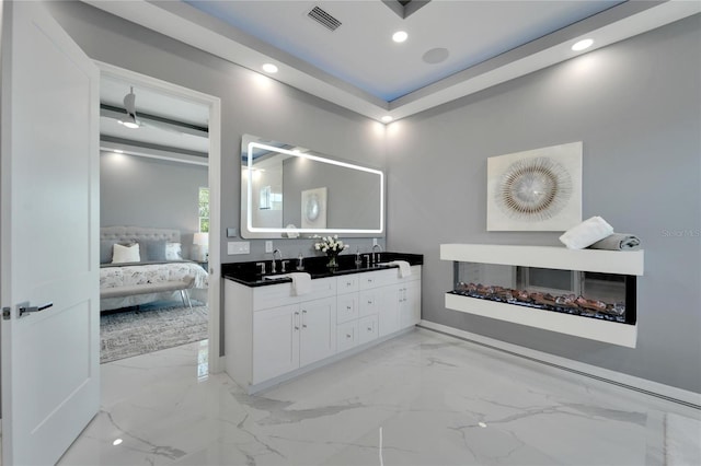 bathroom featuring tile floors, large vanity, and double sink