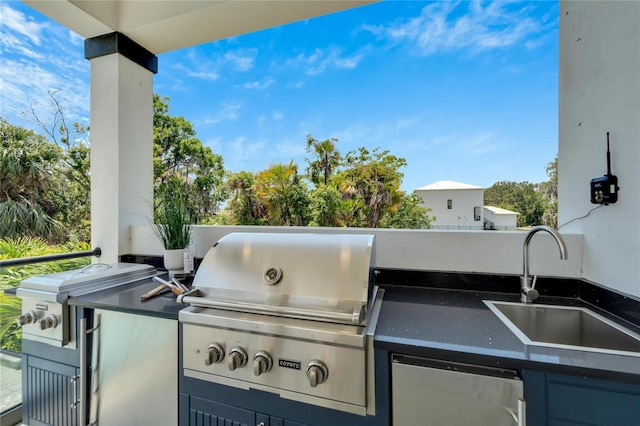 view of patio featuring area for grilling, exterior kitchen, and sink