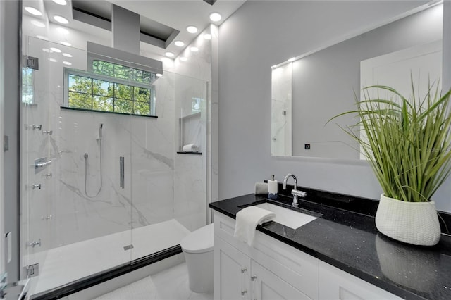 bathroom featuring a shower with door, toilet, tile floors, and large vanity