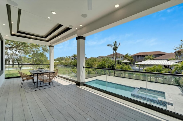 wooden deck featuring a pool with hot tub