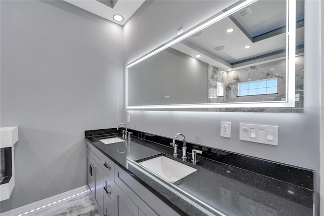 bathroom featuring dual bowl vanity