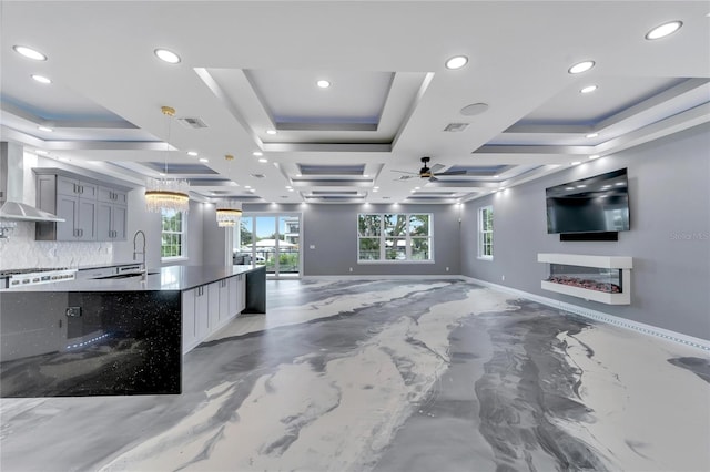 interior space featuring ceiling fan and sink