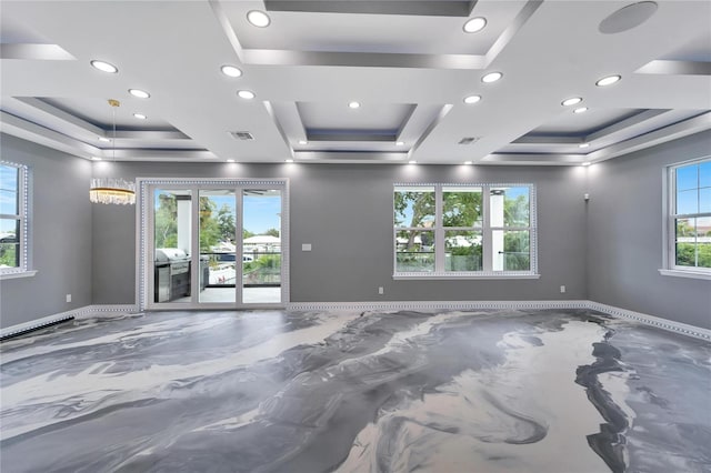 unfurnished room featuring a tray ceiling