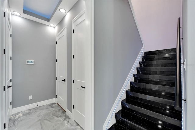 staircase featuring light tile floors