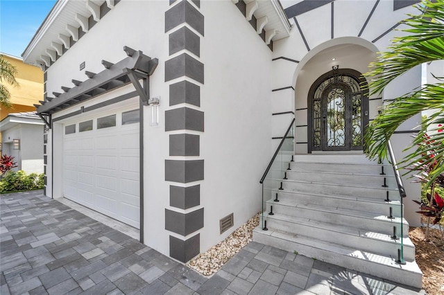 view of exterior entry featuring a garage