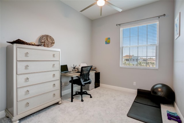 office featuring light carpet and ceiling fan