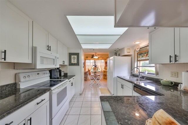 kitchen featuring ceiling fan, sink, light tile patterned floors, white appliances, and white cabinets