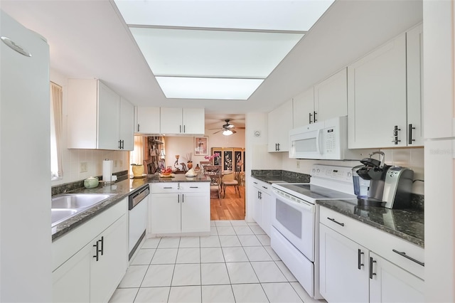 kitchen with white cabinets, white appliances, ceiling fan, and light tile patterned flooring