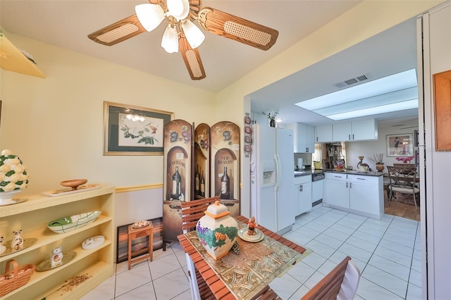 dining area with ceiling fan and light tile patterned floors