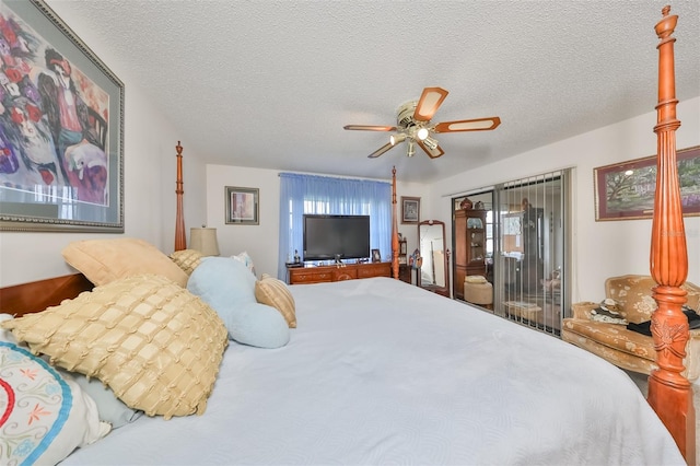 bedroom featuring multiple windows, ceiling fan, and a textured ceiling