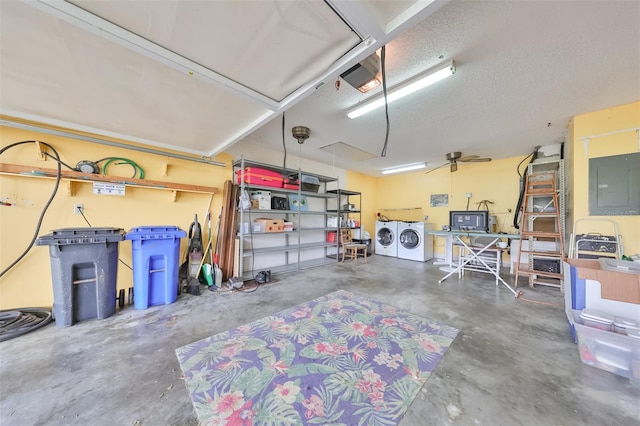 garage featuring separate washer and dryer, ceiling fan, electric panel, and a garage door opener