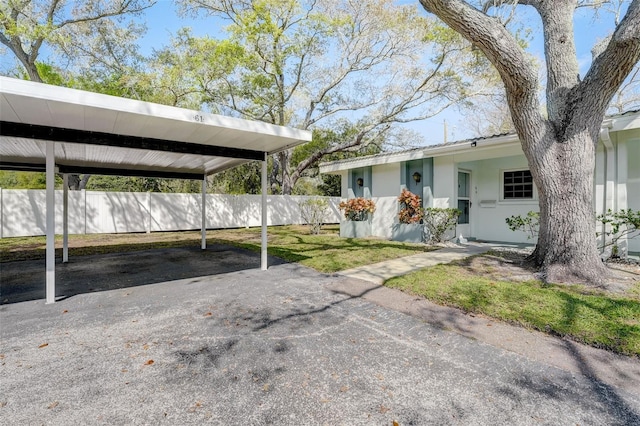 exterior space featuring a carport