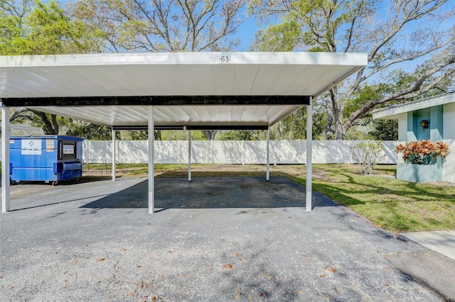 view of vehicle parking with a carport