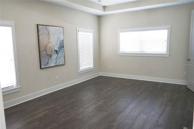 unfurnished room with dark hardwood / wood-style flooring