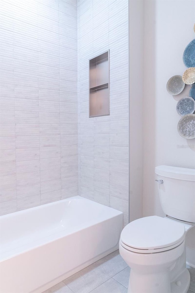 bathroom featuring tile patterned floors and toilet