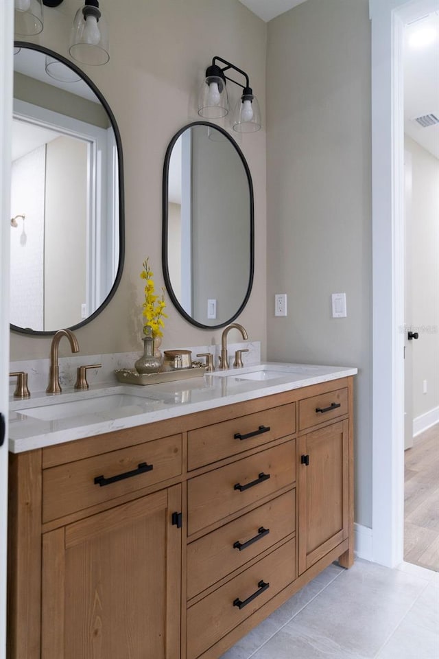 bathroom featuring vanity and tile patterned flooring