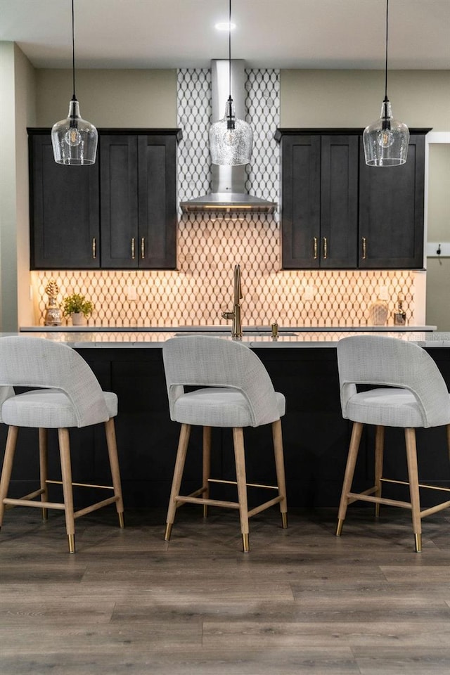 kitchen with pendant lighting and a kitchen bar