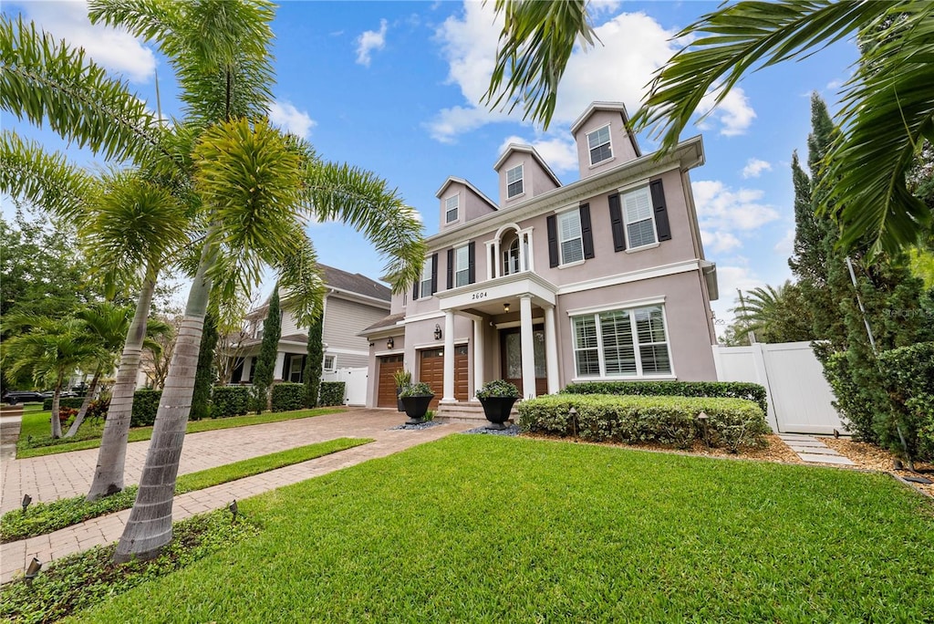 view of front facade featuring a front yard and a garage