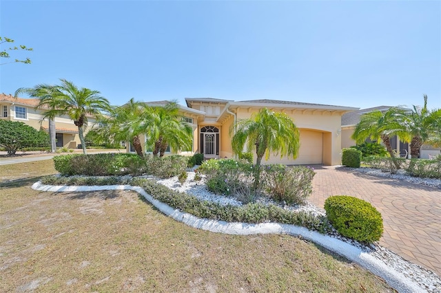 mediterranean / spanish-style house with a garage