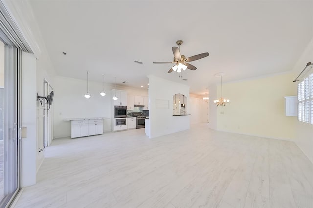 unfurnished living room featuring light hardwood / wood-style floors, ceiling fan with notable chandelier, and crown molding