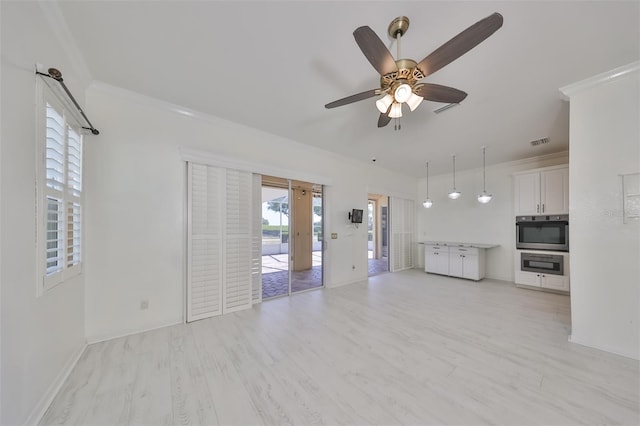 unfurnished living room featuring light hardwood / wood-style floors, ceiling fan, and french doors