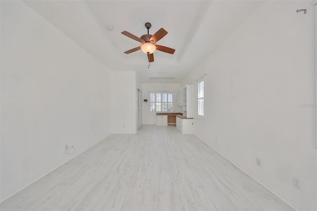 unfurnished living room with light hardwood / wood-style flooring and ceiling fan