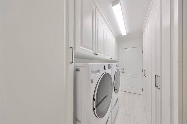 laundry area featuring cabinets and washer and dryer